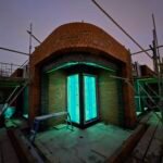 Curved brick entrance construction progressing on site