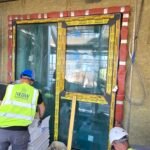 Fire stopping installation around door opening with approved fire-resistant materials