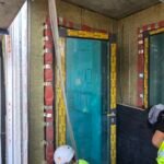 Fire stopping works around window frame with cavity closure system