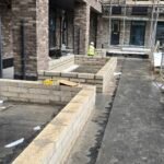 Blockwork installation forming external planter and wall features