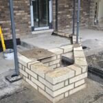 Raised blockwork wall construction on development site