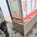 Cavity wall construction with insulation and moisture protection