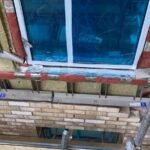 Cavity wall insulation installed to multiple window openings
