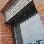 Brickwork installation around window opening with clean masonry finishes
