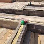 Full-fill cavity insulation installed along structural wall junction