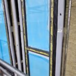 Fire stopping installation around window opening prior to final finishes