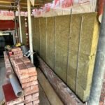 Cavity wall insulation installation completed prior to brickwork closing