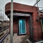 Residential bricklaying work forming window and door surrounds